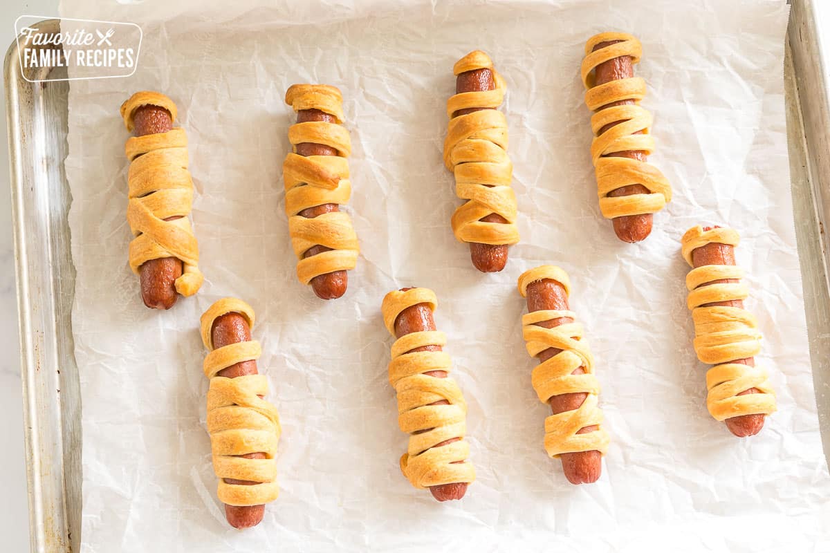 Hot dogs wrapped in crescent roll dough and cooked to look like mummies