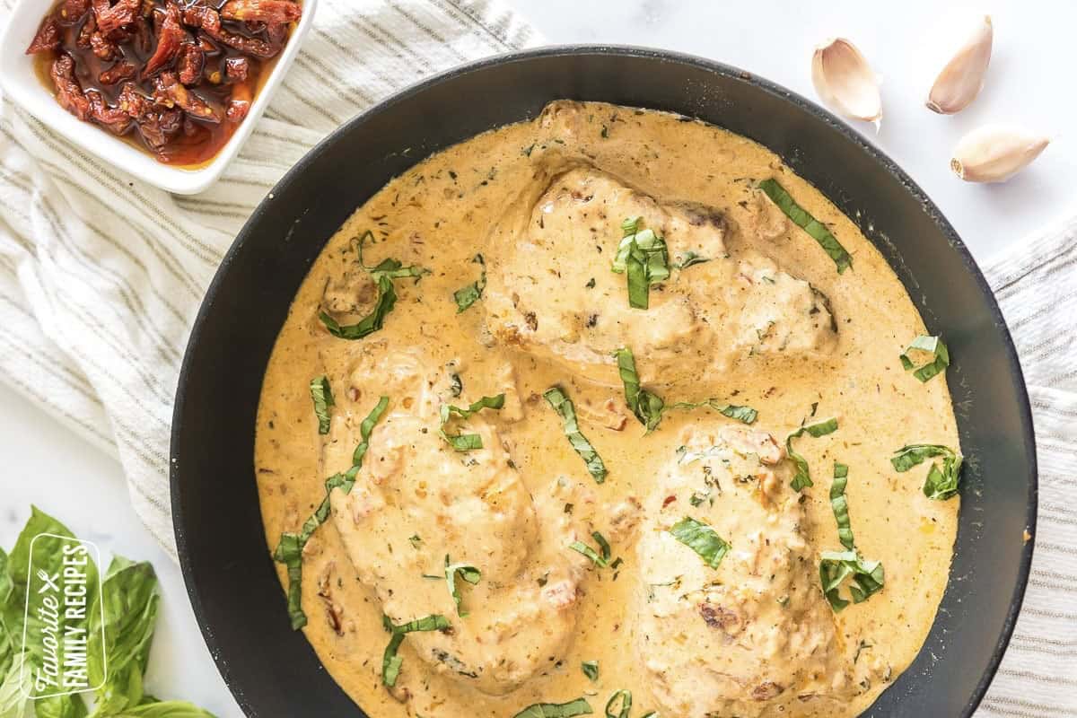 Whip up a batch of Marry Me Chicken tonight! It is an irresistible dish with tender, flavorful chicken, and a creamy sauce served over pasta. Marry Me Chicken in a black skillet
