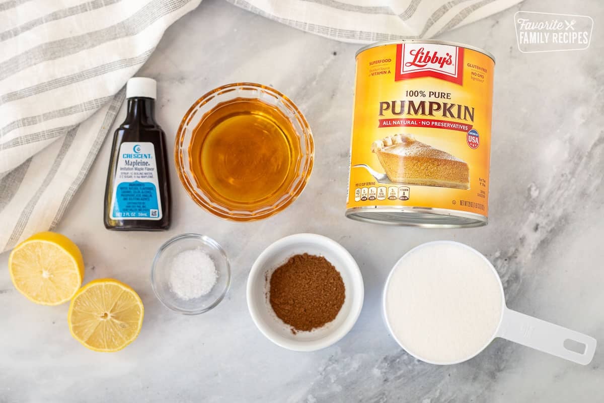 Ingredients to make Pumpkin Butter including pumpkin, Mapleine, apple cider, salt, lemon, pumpkin pie spice and sugar.