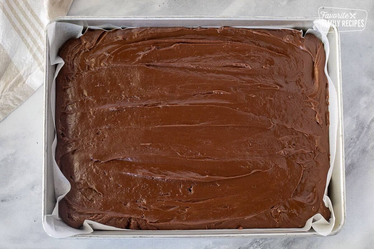 Spread out See's Fudge in a baking dish lined with parchment paper.