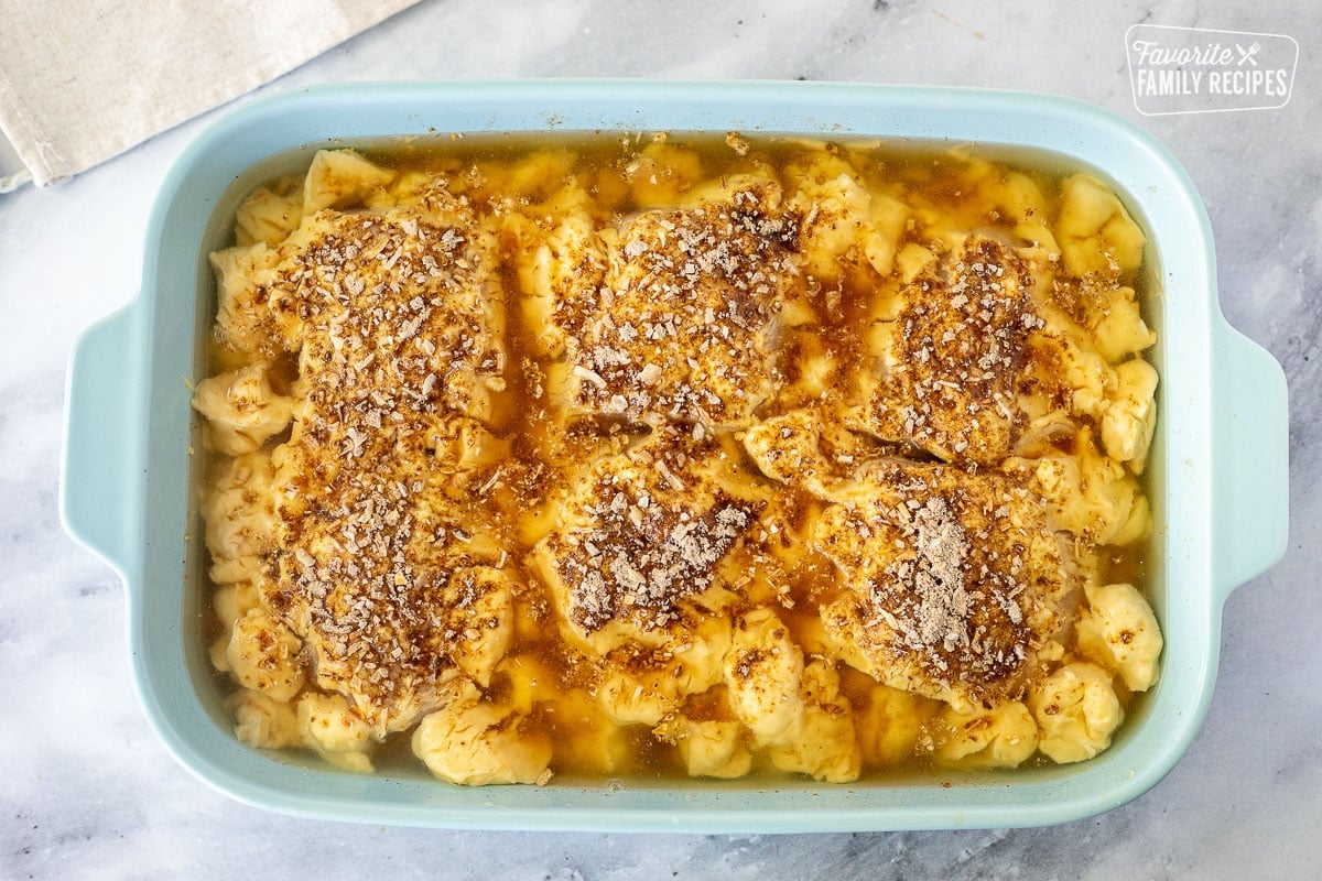 Casserole dish with unbaked Cheesy Chicken and Rice Casserole.