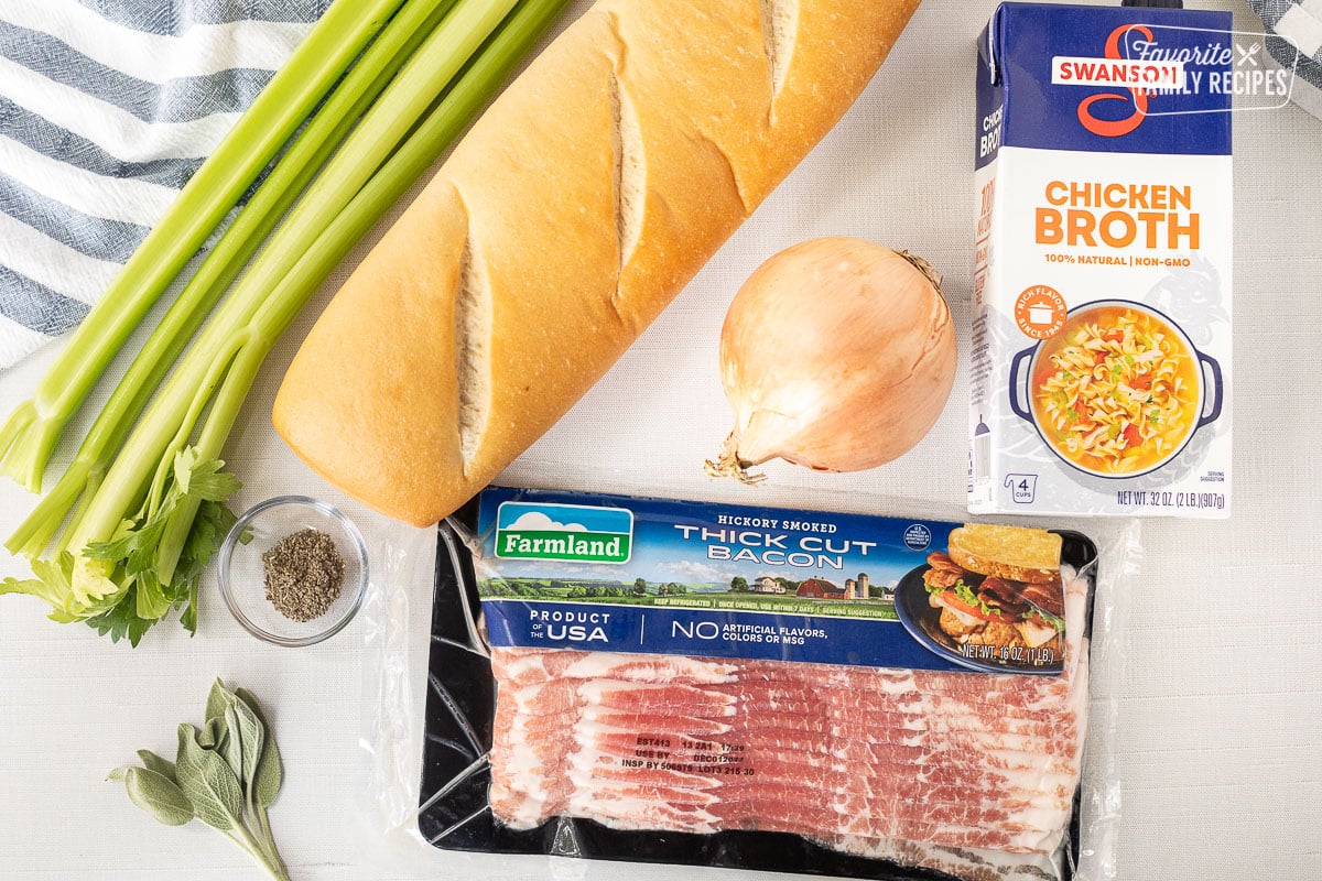 Ingredients to make Bacon Stuffing including bacon, celery, French bread, chicken broth, onion and sage.
