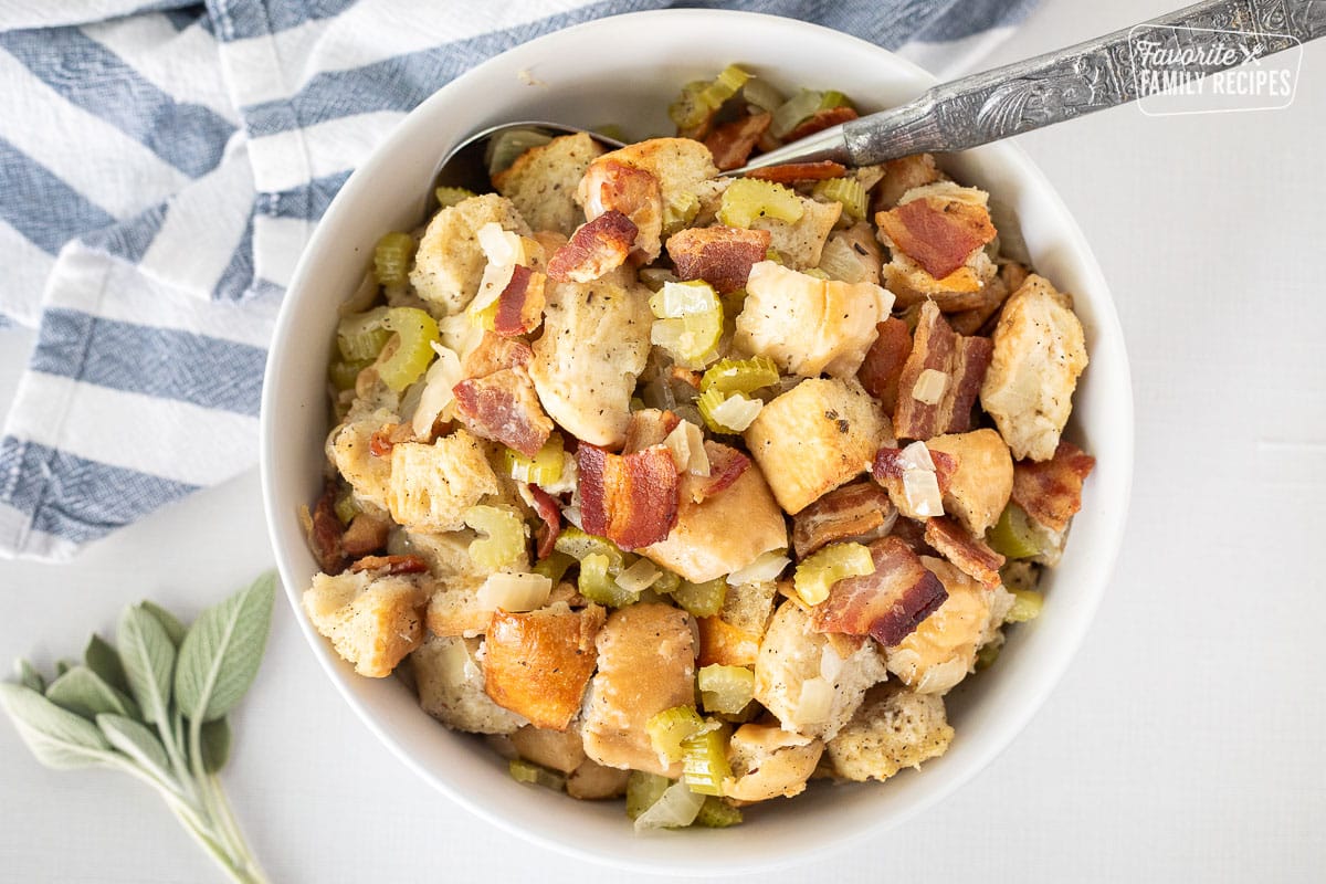 Large bowl with Bacon Stuffing and serving spoon.