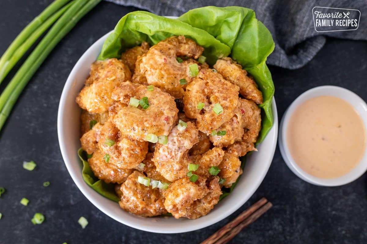 Bowl of Bonefish Grill's Bang Bang Shrimp. Chop sticks on the side.