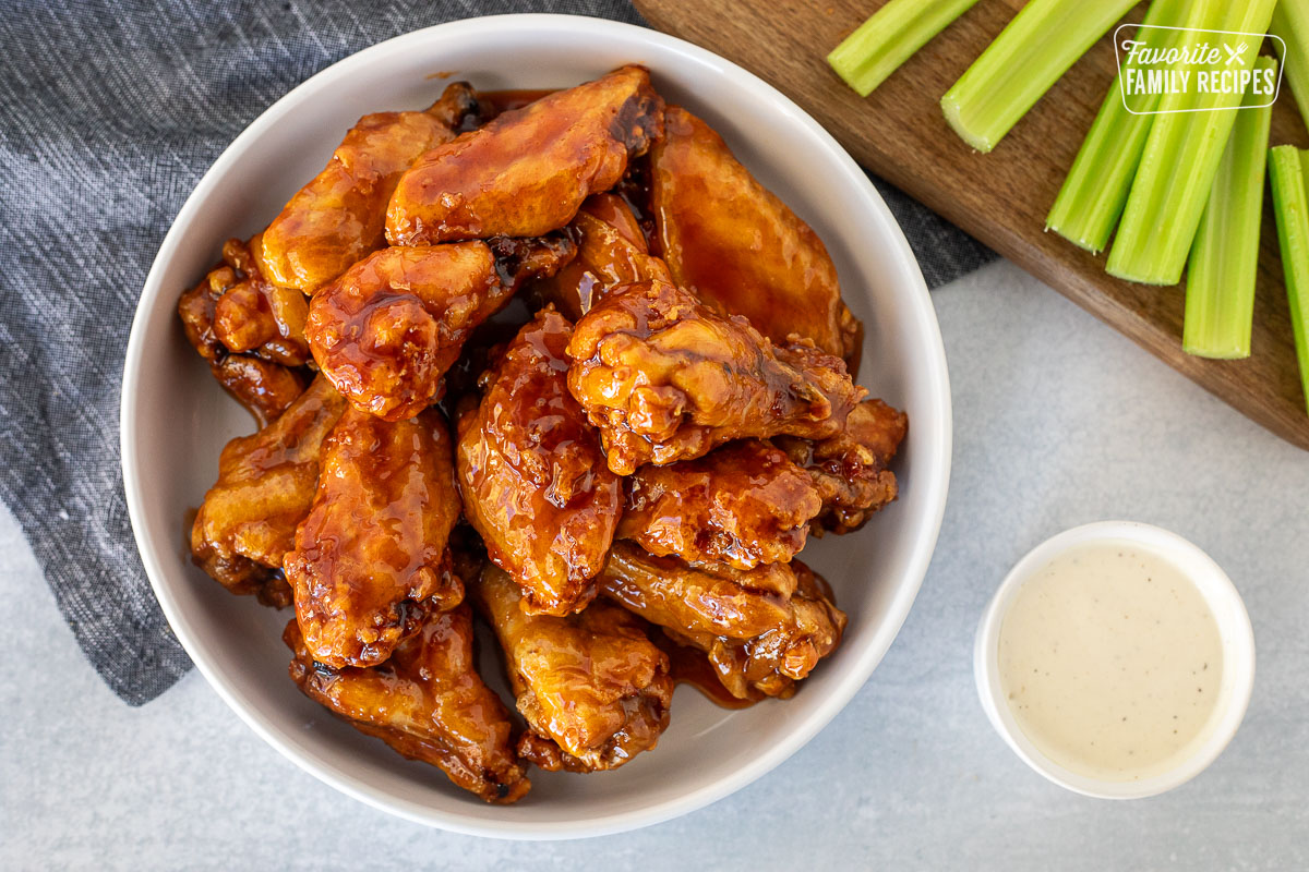 Bowl of Winger's Wings with Freakin Amazing Sauce. Ranch on the side and sliced celery.