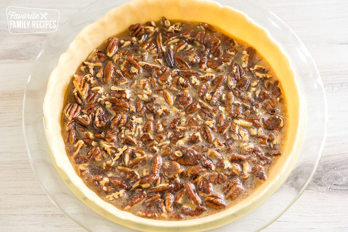 Unbaked pecan pie in a pie dish