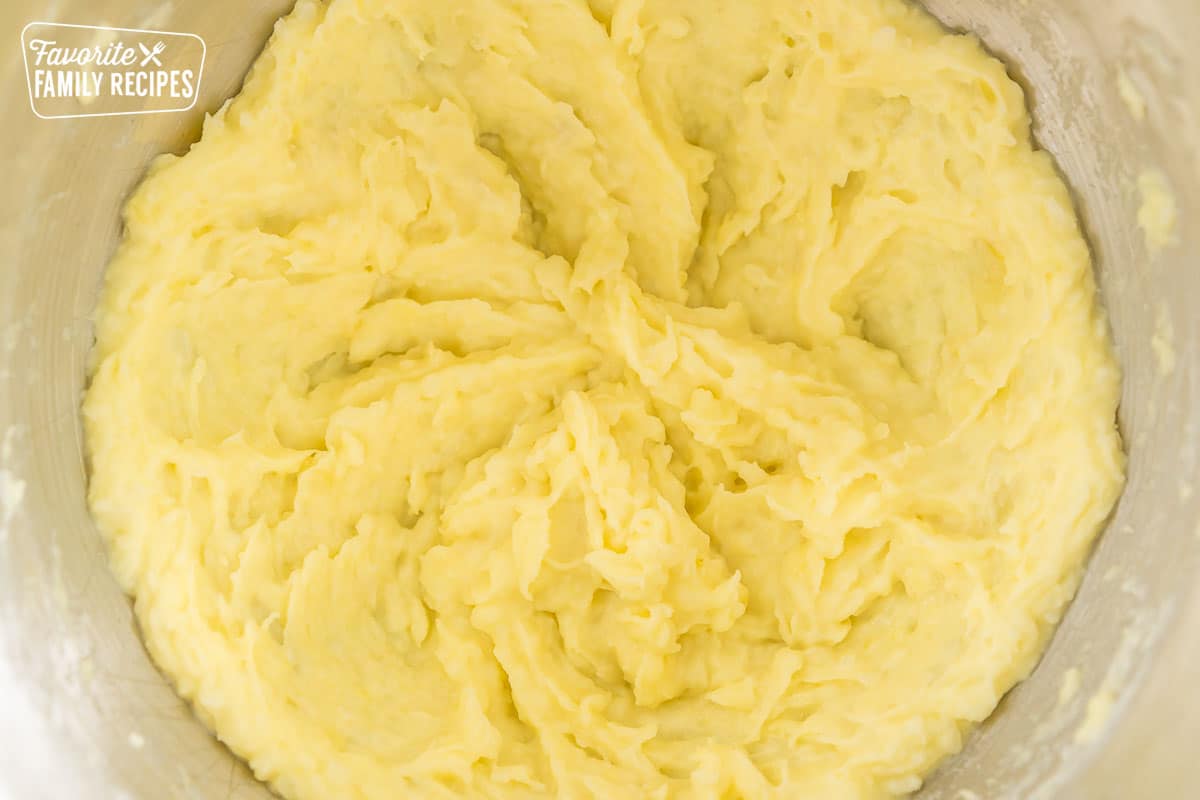 cauliflower mashed potatoes mashed in a mixing bowl