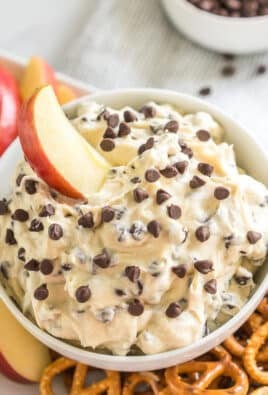 a pretzel dipped in chocolate chip cookie dough dip