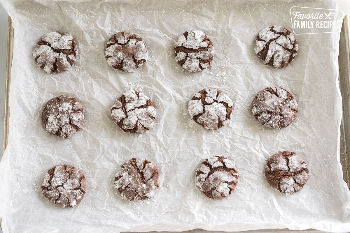 Chocolate crinkle cookies on a baking sheet