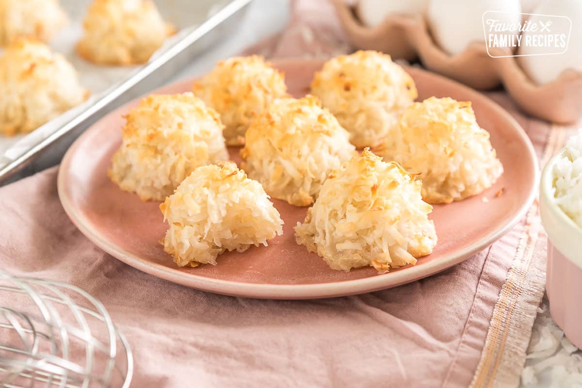 coconut macaroons on a plate with a bite taken out of one