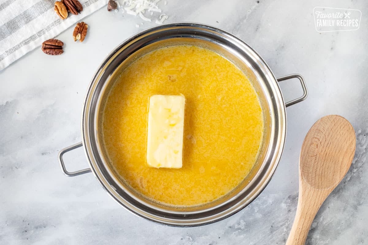 Heavy pot with egg yolk, butter and evaporated milk.