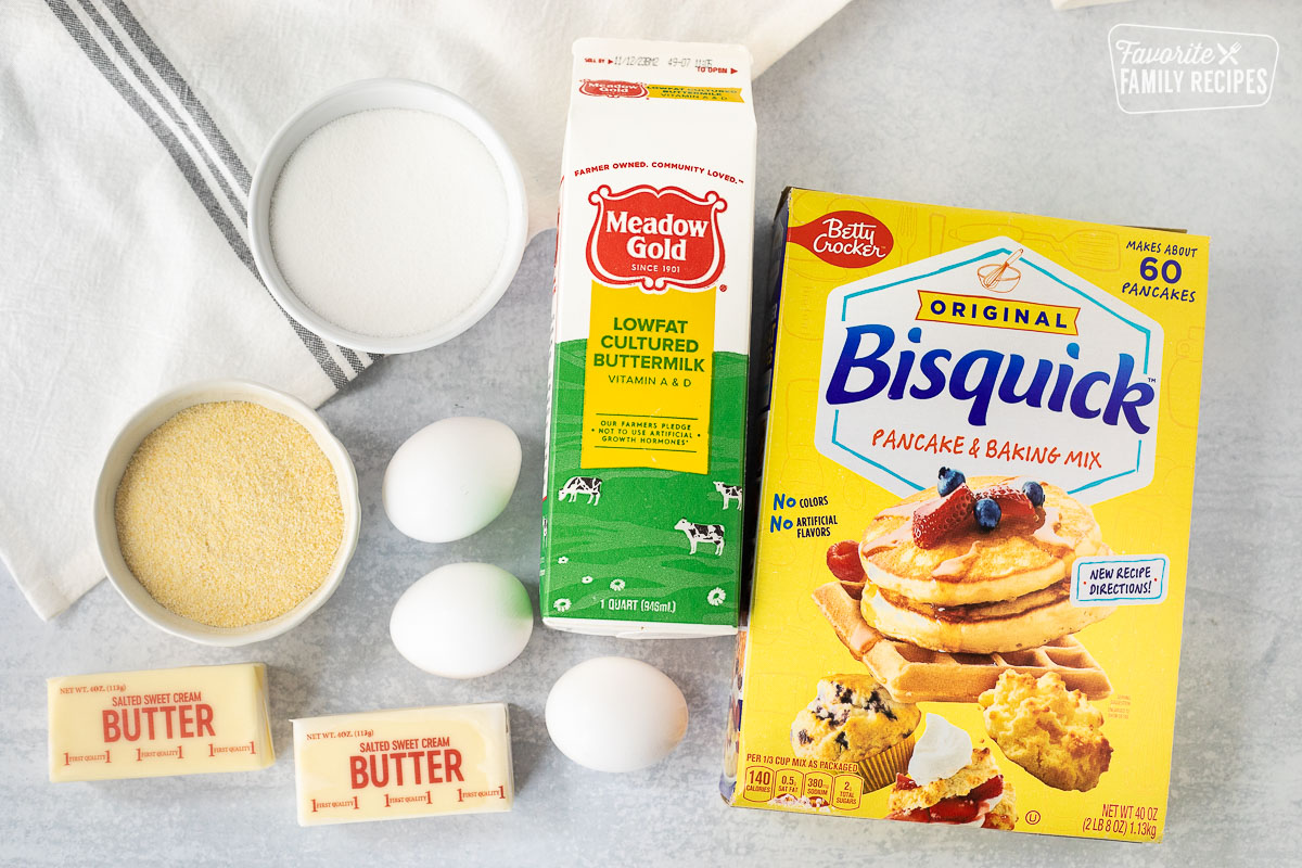 Ingredients to make Cornbread including Bisquick, Buttermilk, eggs, sugar, cornmeal and butter.