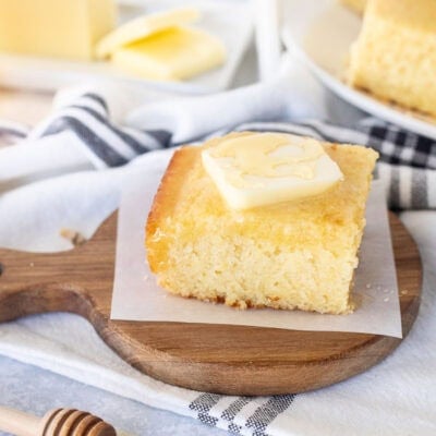 Piece of Cornbread with butter and honey.