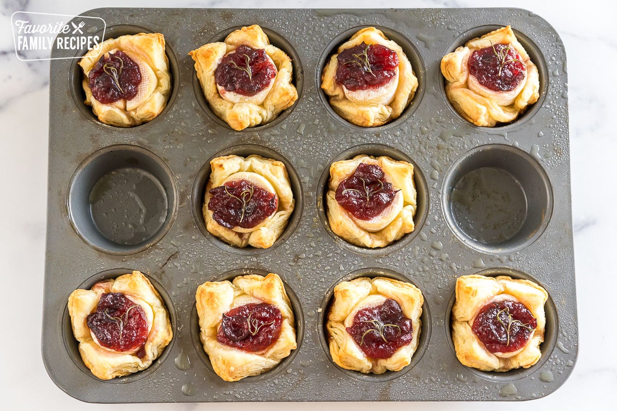 Baked puff pastry appetizers in a muffin tin