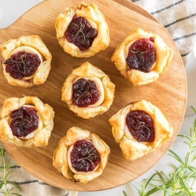 Cranberry Brie Bites on a wooden board
