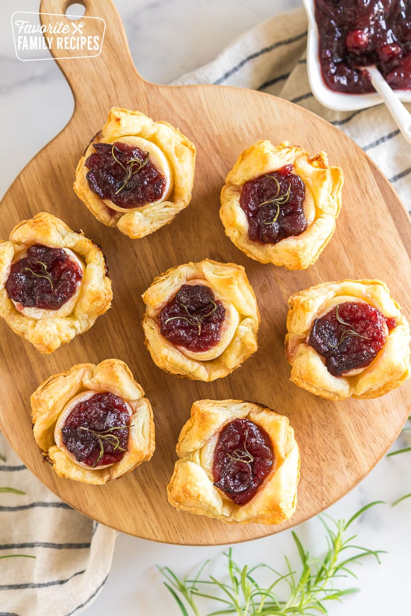 Cranberry Brie Bites on a wooden board