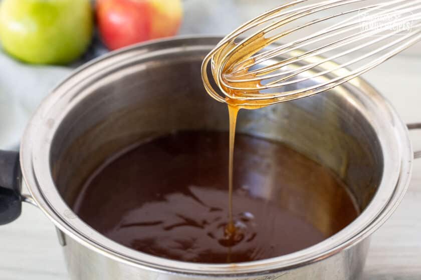 Whisk drizzling glaze for Apple Pie filling into a pan.