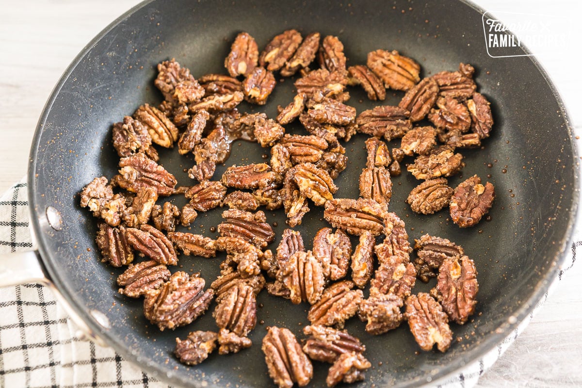 pumpkin spice candied pecans in a pan