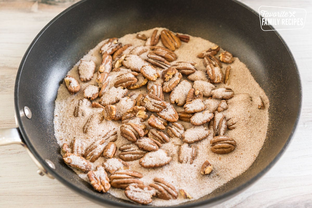 pecans, sugar, and pumpkin pie spice in a skillet