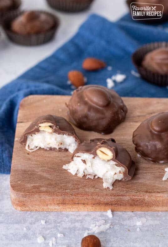 Cut open Homemade Almond Joy on a cutting board.