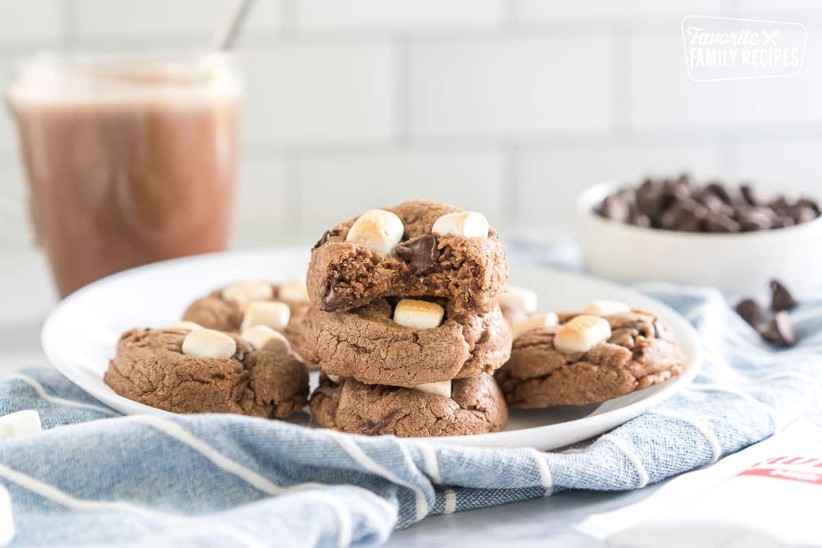 hot chocolate cookies on a plate with a bite taken out of one