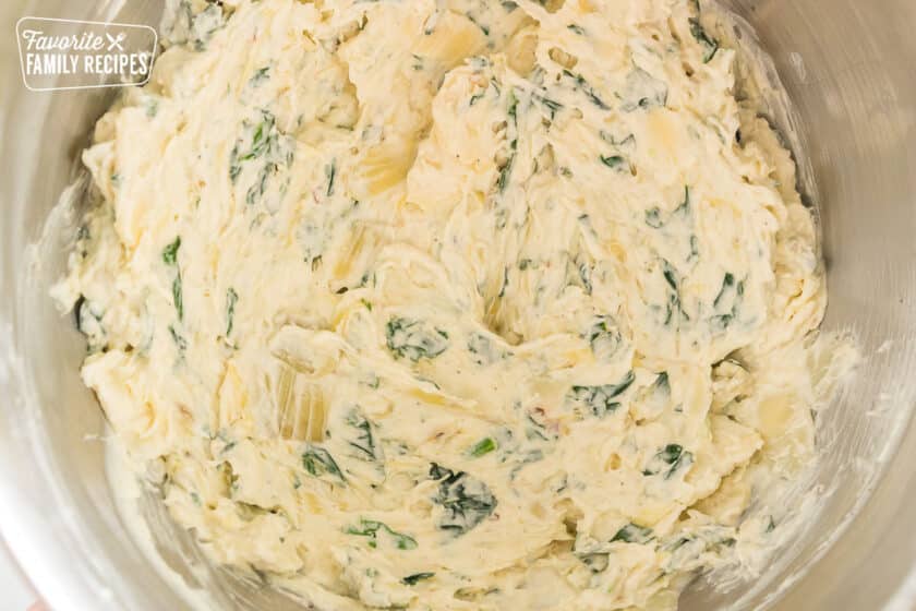 spinach artichoke dip in a mixing bowl