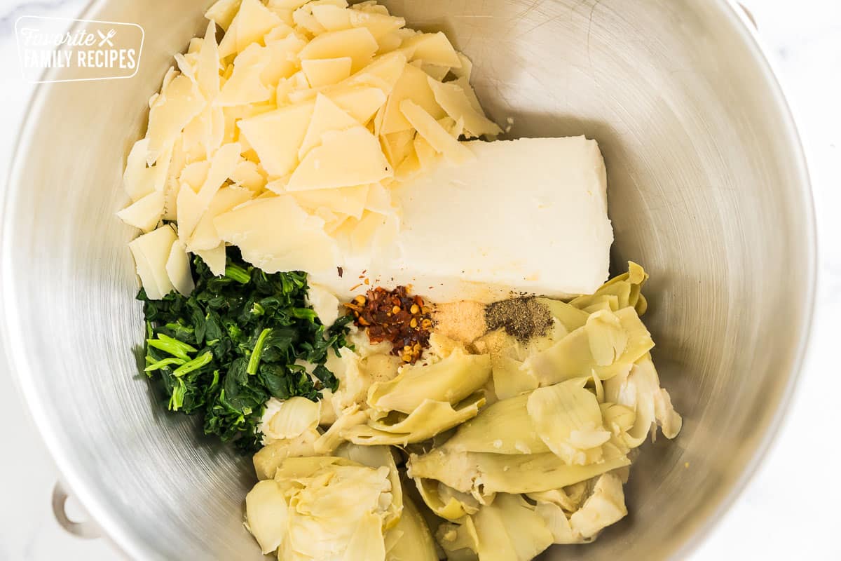 cream cheese, parmesan, spinach, artichokes, and spices in a mixing bowl