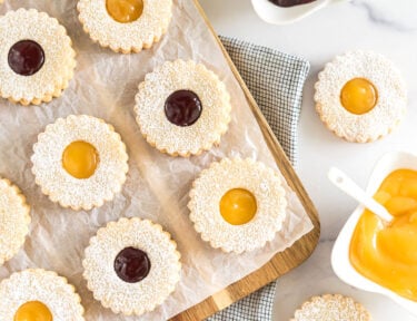 Linzer cookies on a cutting board