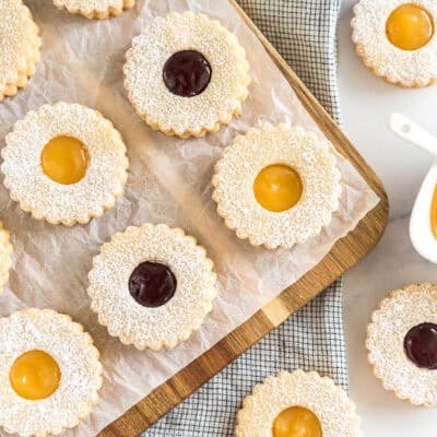 Linzer cookies on a cutting board