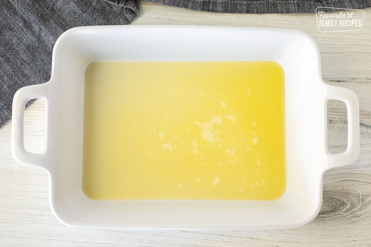Baking dish with melted butter.