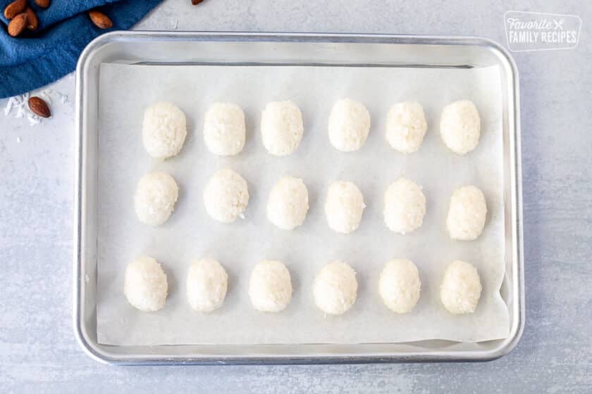 Coconut balls on a baking sheet.