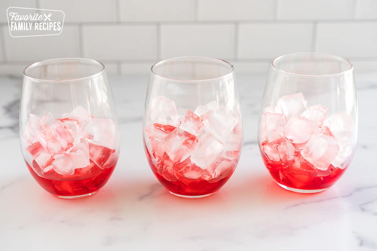 glasses with ice and grenadine syrup
