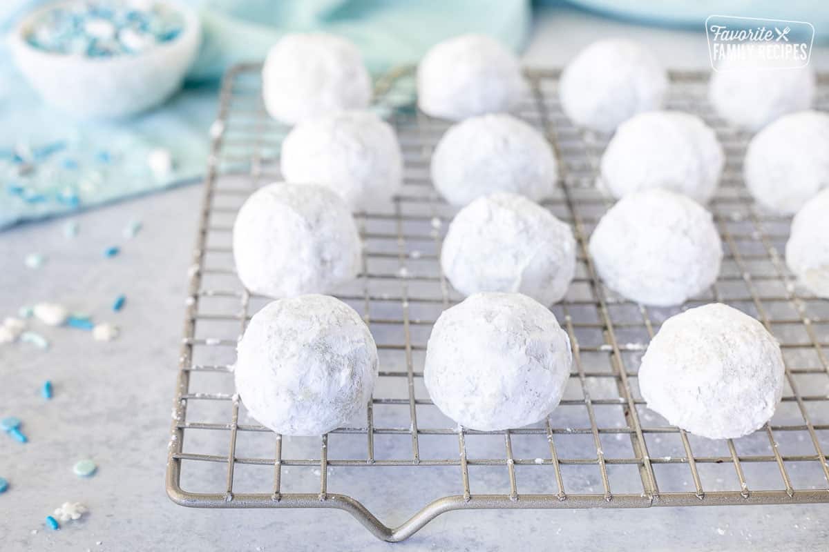 Cooling rack with Snowball cookies.