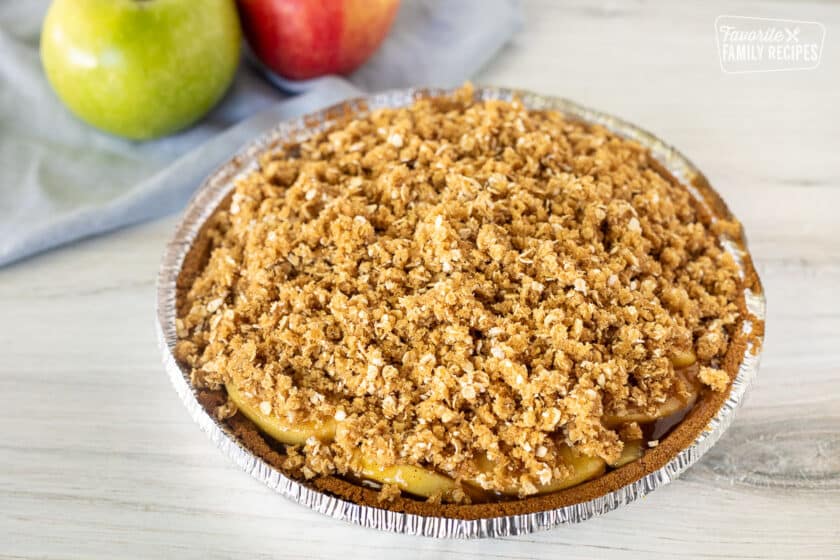 Crumble topping on unbaked Gluten Free Apple Pie.