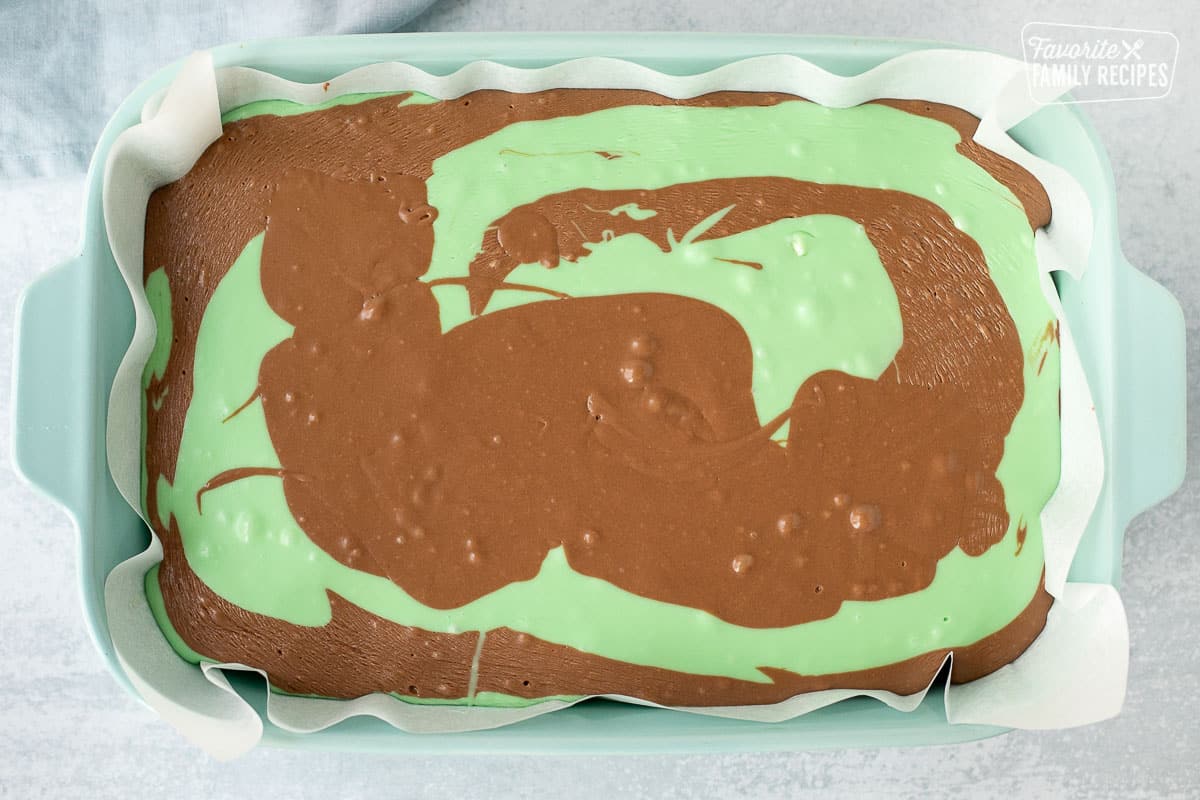Baking dish with mint and chocolate fudge poured.