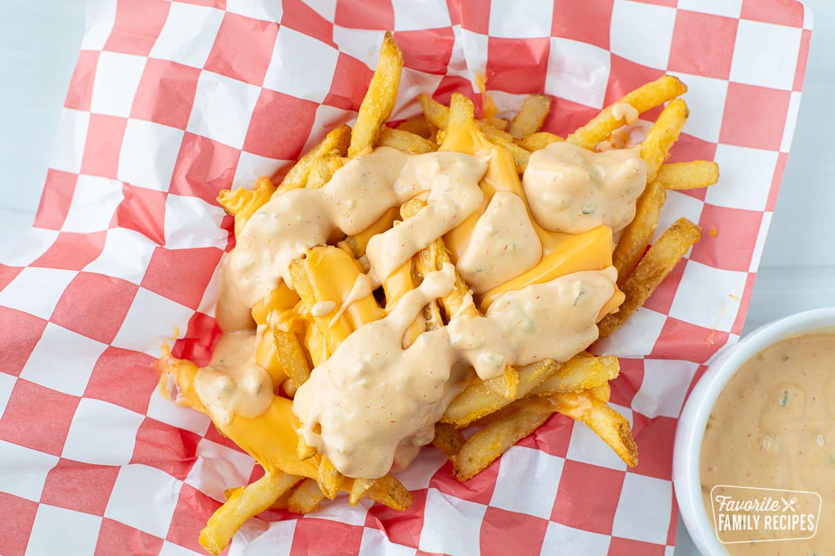 In N Out fries in a basket with cheese and sauce (no onions)