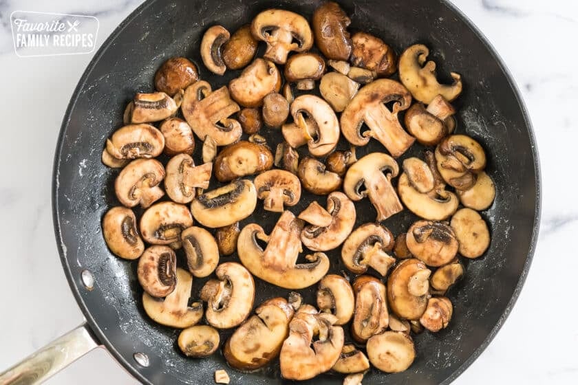 mushrooms sautéing in a pan