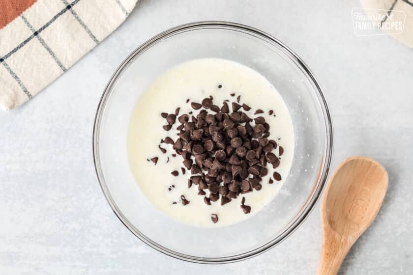 Mixing bowl of cream and chocolate chips.