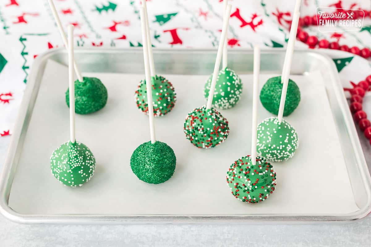 Cookie sheet of drying Christmas Cake Pops.