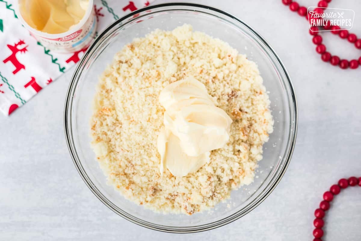 Mixing bowl with crumbled white cake and frosting to make cake pops