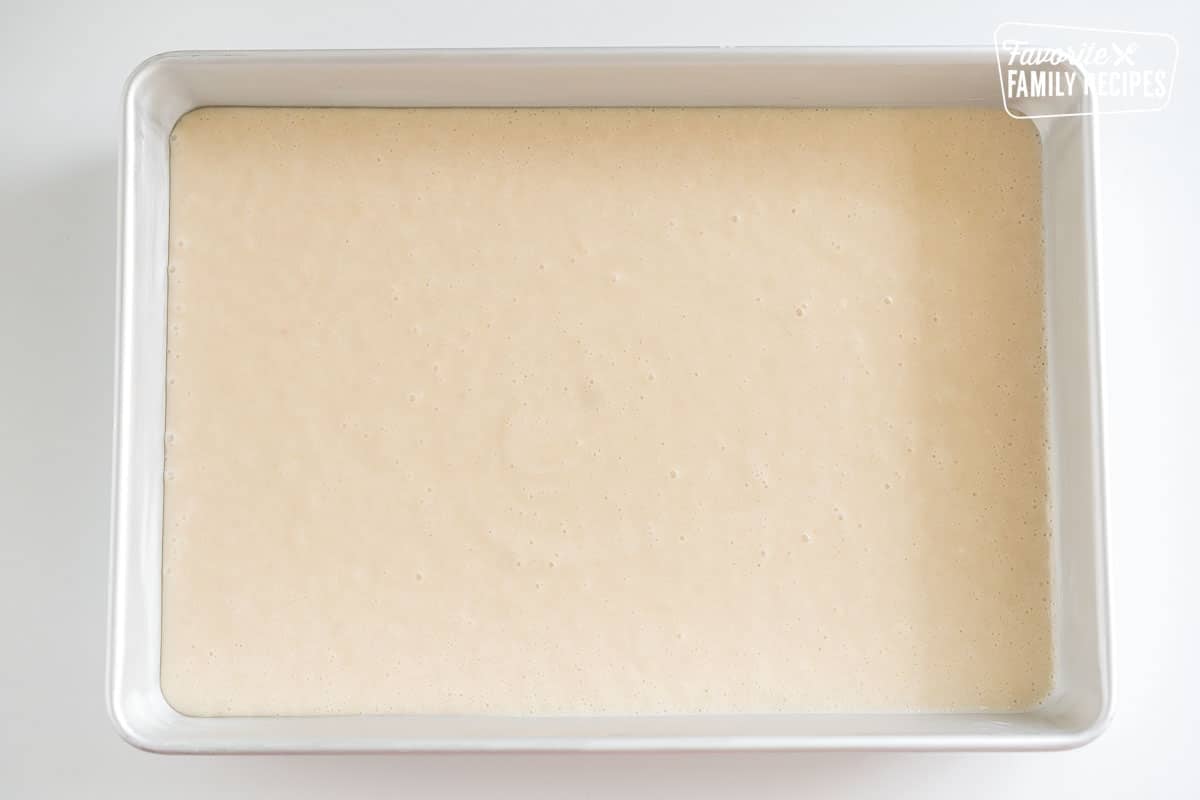 Vanilla cake batter in a baking dish.