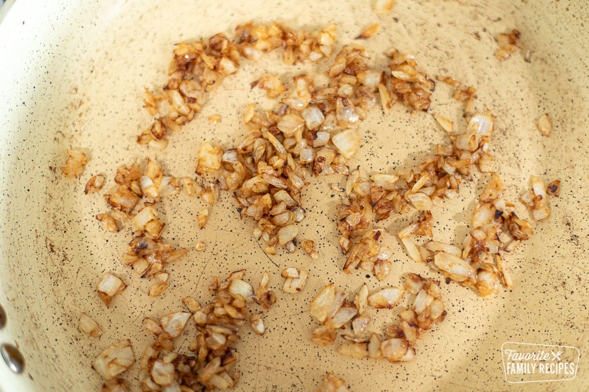 A skillet with sautéed diced onions