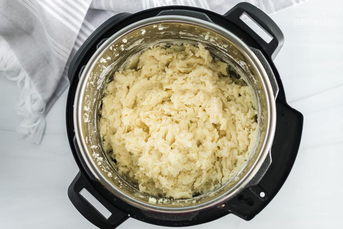 An instant pot with mashed potatoes.