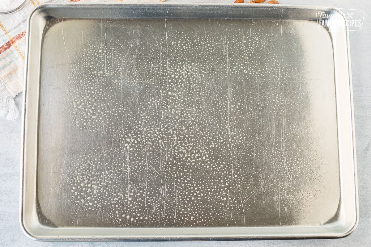 Baking sheet with non stick cooking spray for Microwave Peanut Brittle.