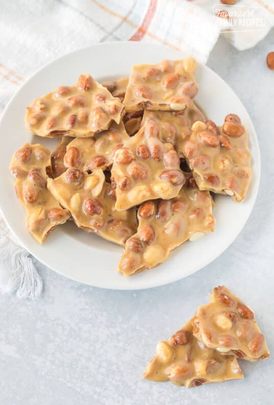 Plate of Microwave Peanut Brittle broken in pieces.