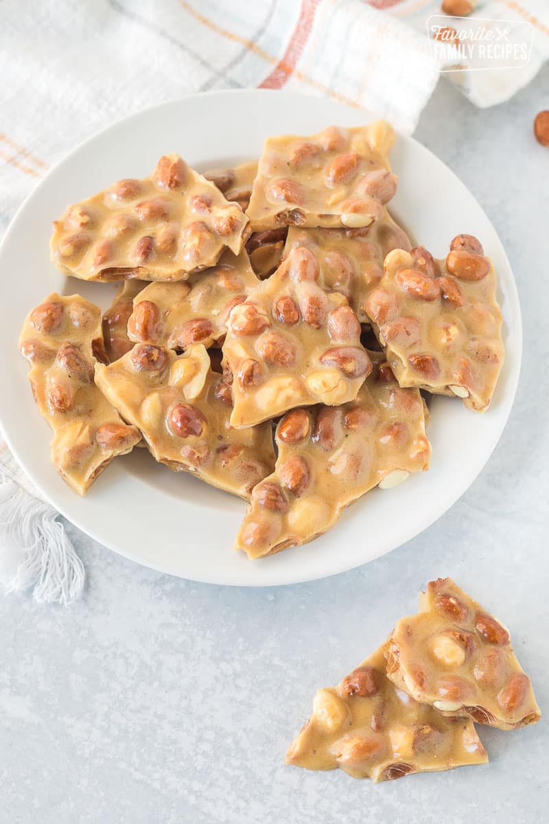 Plate of Microwave Peanut Brittle broken in pieces.