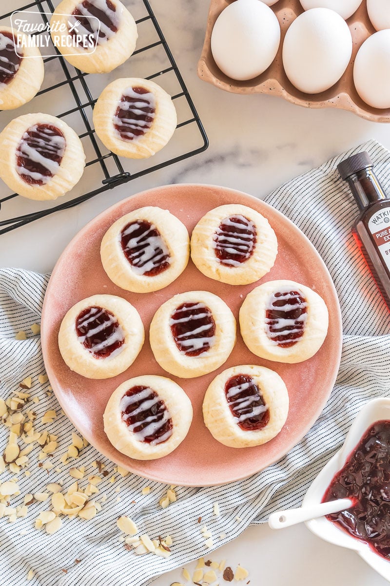 a plate of raspberry thumbprint cookies