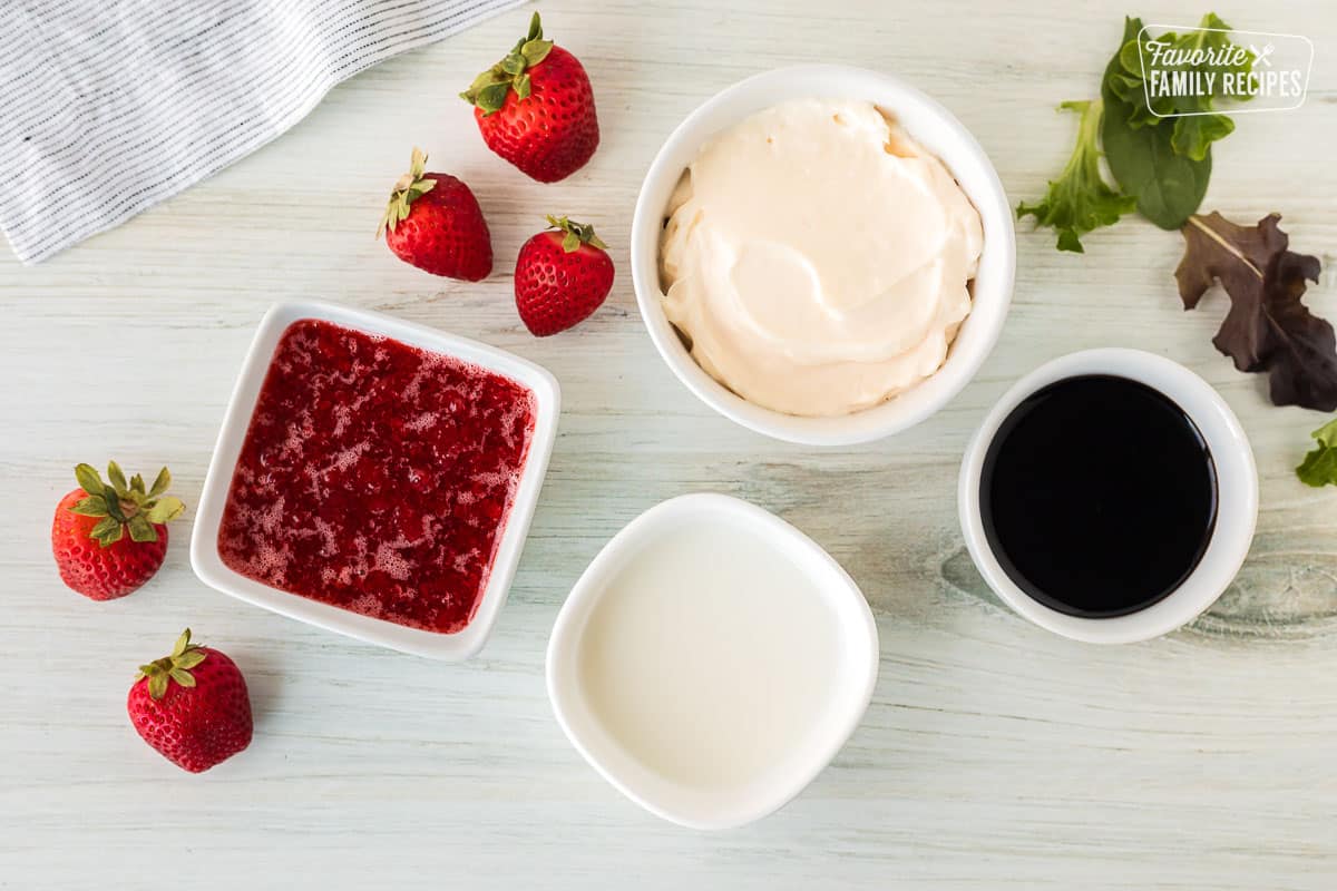 Ingredients to make Strawberry Vinaigrette including mayonnaise, balsamic vinegar, strawberry preserves and milk.