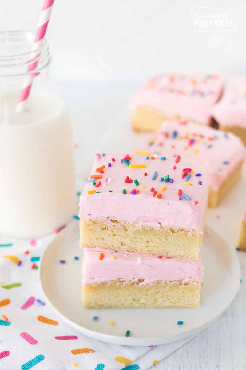 Two Sugar Cookie Bars stacked on a plate.