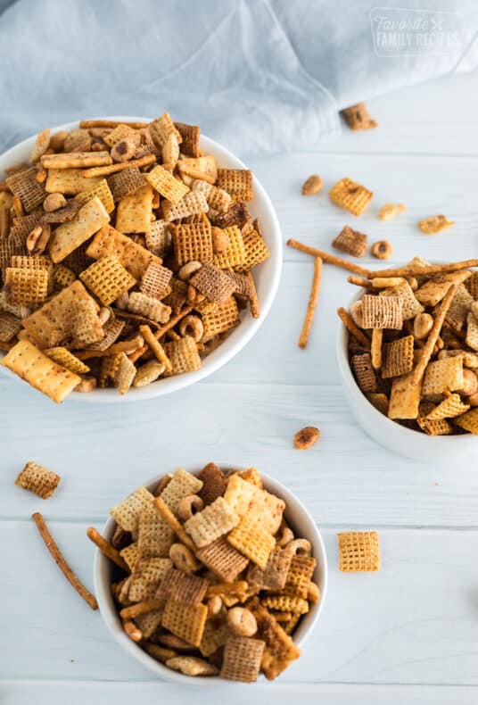 A overhead shot of three bowls of chex mix
